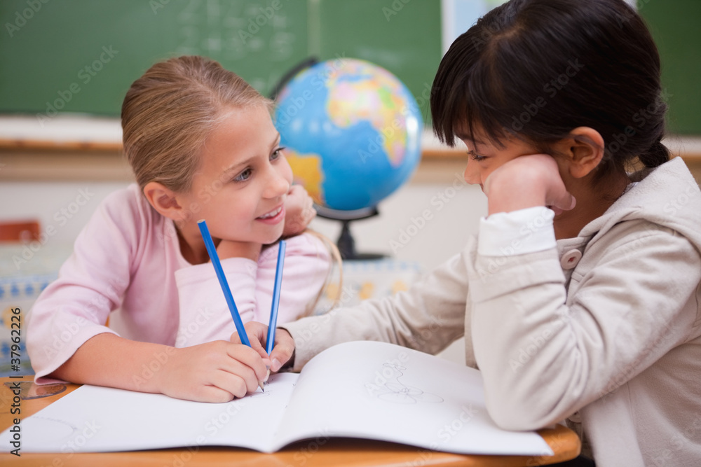 Cute schoolgirls doing classwork Cute schoolgirls doing classwork