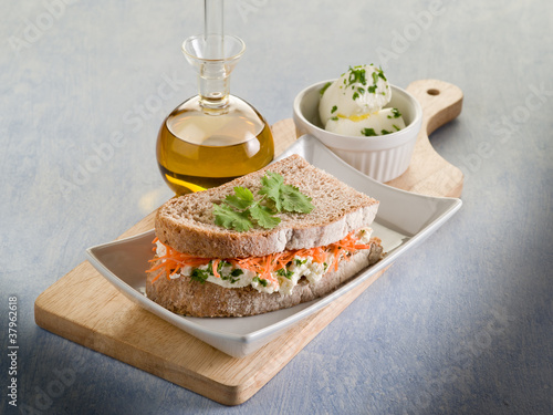 healthy sandwich with carrot cheese and parsley photo