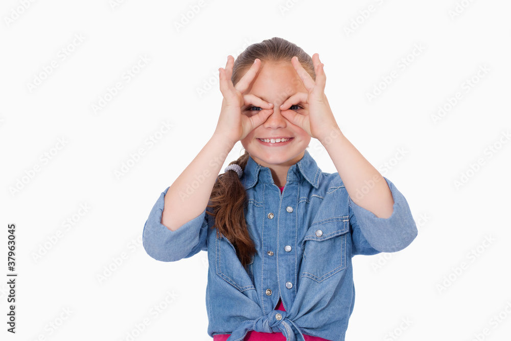 Girl with her fingers around her eyes Girl with her fingers around her eyes