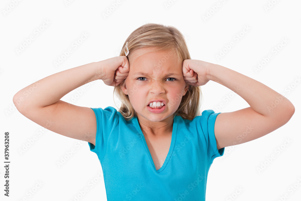 Unhappy girl with the fists on her face Unhappy girl with the fists on her face