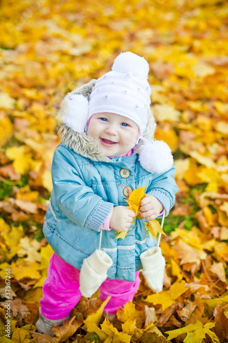 Little Girl With Yellow Leaf