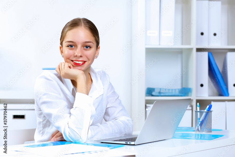 Young woman in business wear working in office Young woman in business wear working in office