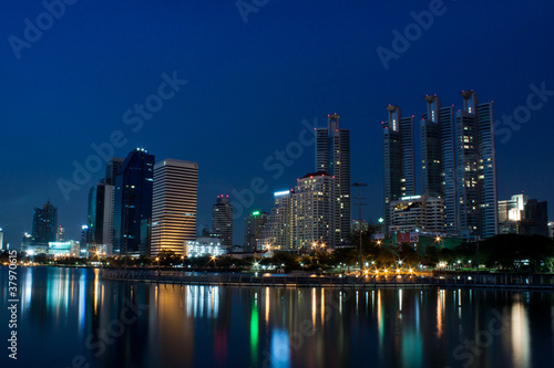 Bangkok city at night with reflection of skyline