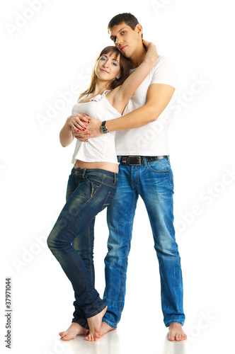 Young beautiful heterosexual couple on white background