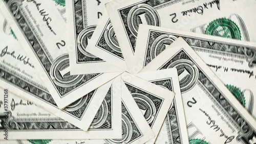 Rotating dollar bills (seamless loop)