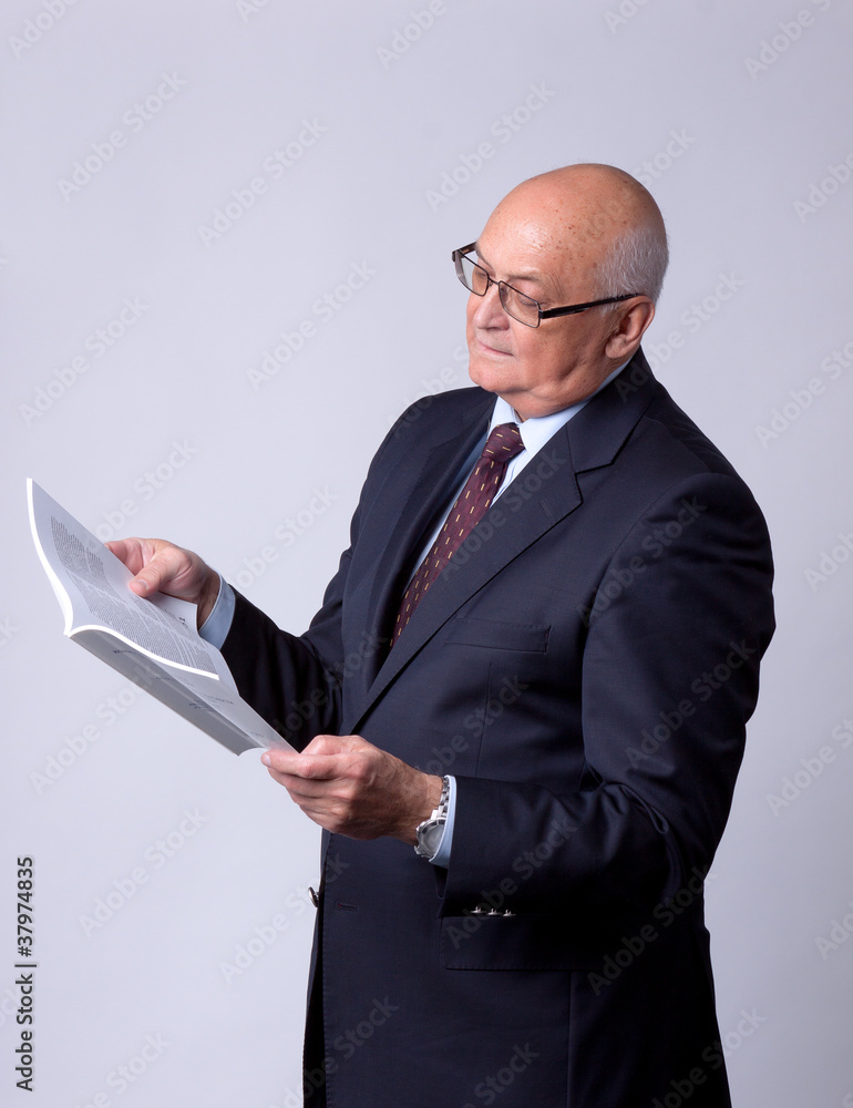 portrait of a successful senior man with book portrait of a successful senior man with book