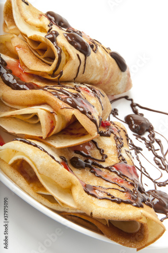 pancakes with chocolate and strawberry syrup