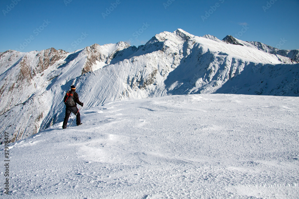 Boy trekking in the mountains, winter