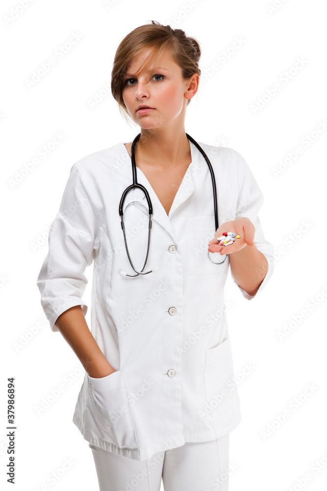 Young female doctor holding pills isolated on white background Young female doctor holding pills isolated on white background