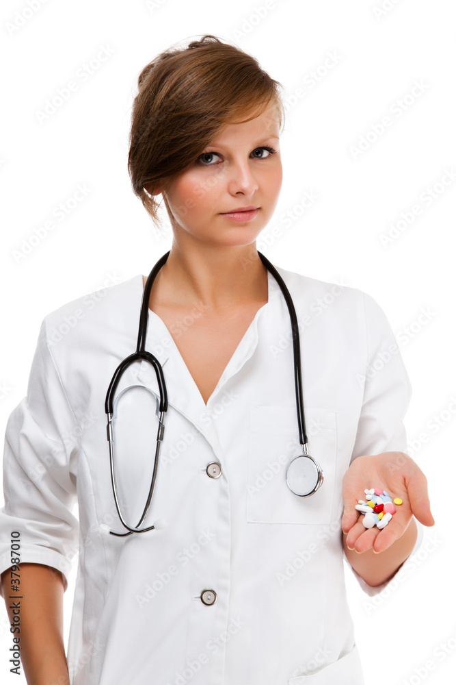 Young female doctor holding pills isolated on white background Young female doctor holding pills isolated on white background