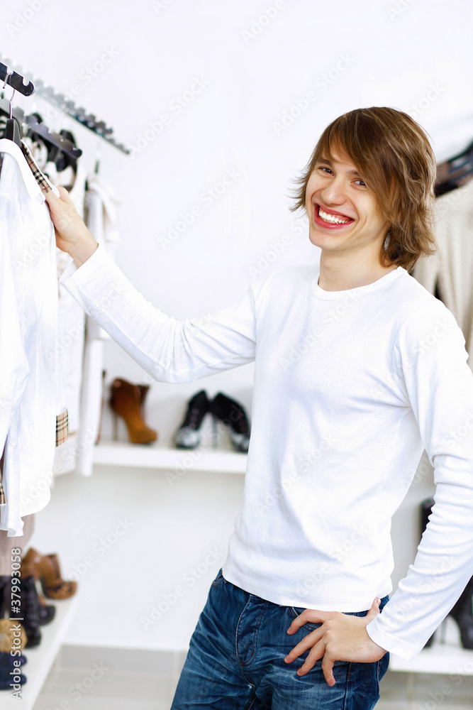 Fototapeta premium Young man doing shopping