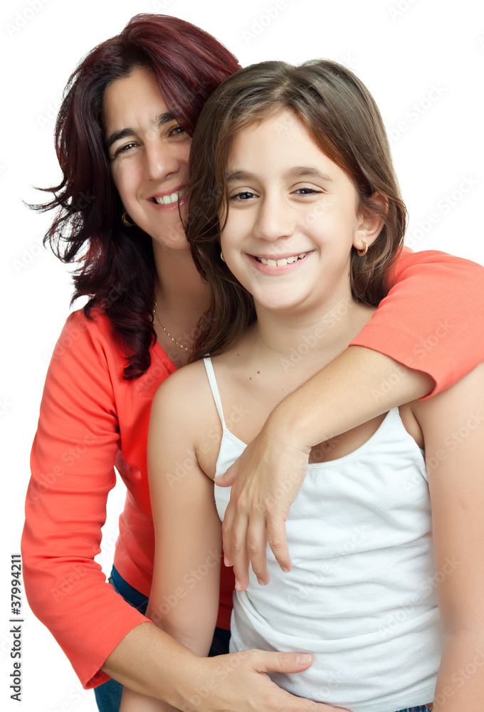 Young latin mother hugging her daughter isolated on white Young latin mother hugging her daughter isolated on white
