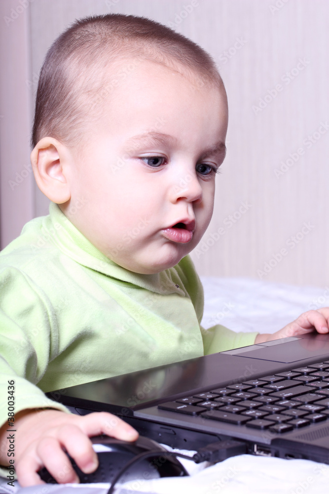 child working at a computer child working at a computer