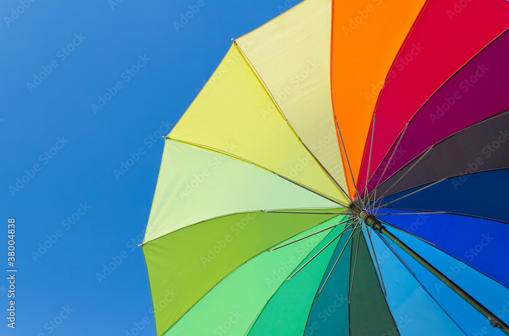 Colorful umbrella on a sky background