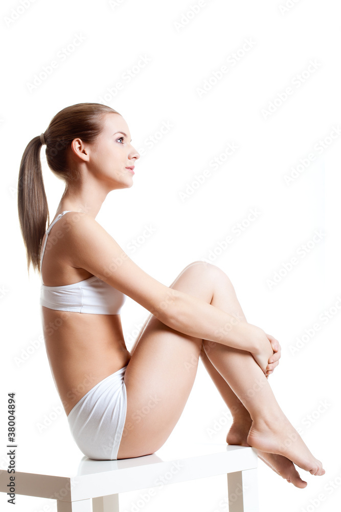 blonde woman sitting on table