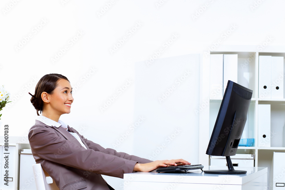 Young woman in business wear working in office Young woman in business wear working in office