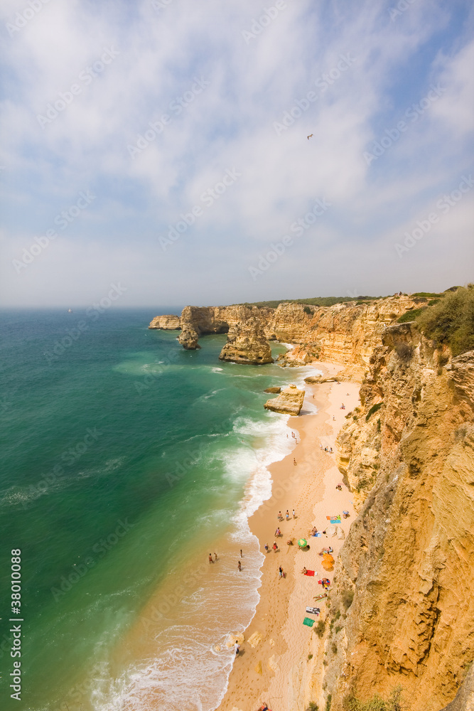 Idyllic wild beach in summertime. Algarve, Portugal.