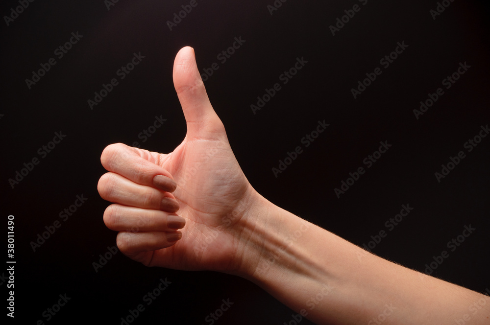 woman hand on black background