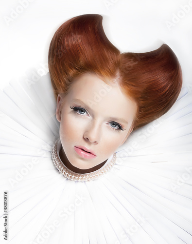 Glamorous young red hair model in white collar and pearls