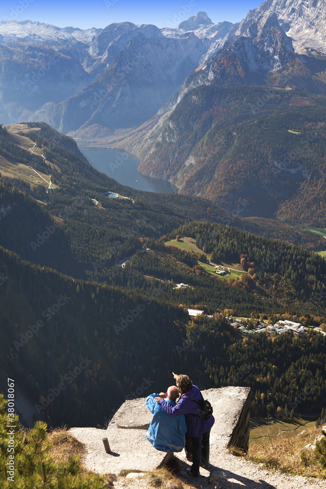 couple enjoying view of lake in german alps