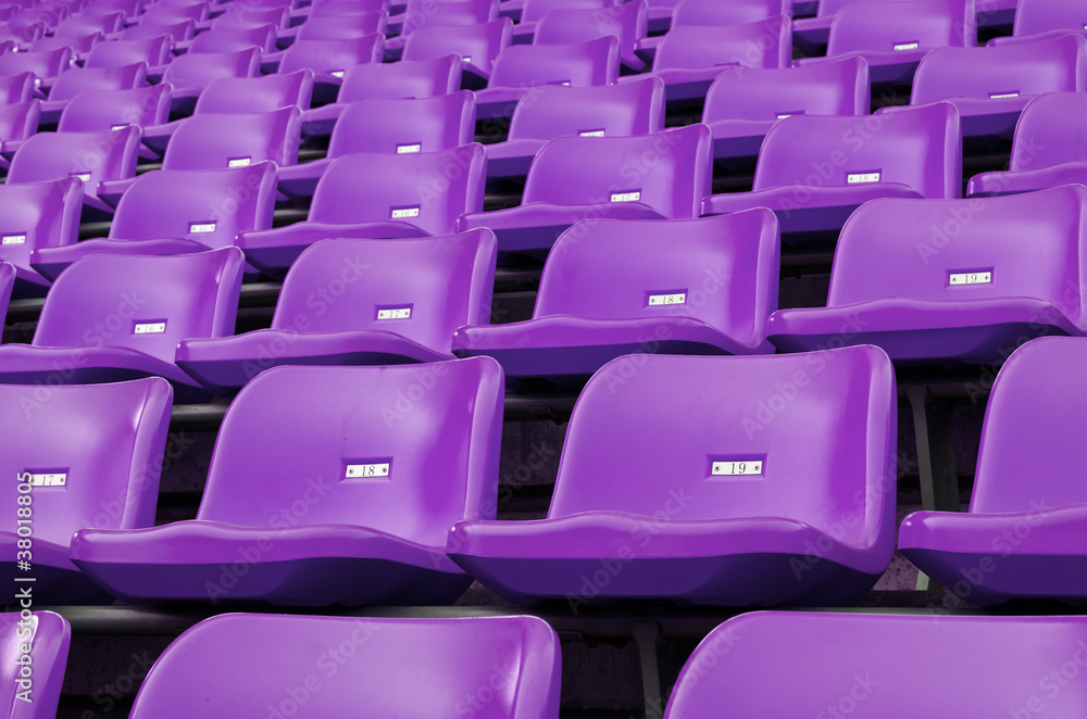 Fototapeta premium Purple Empty plastic seats at stadium