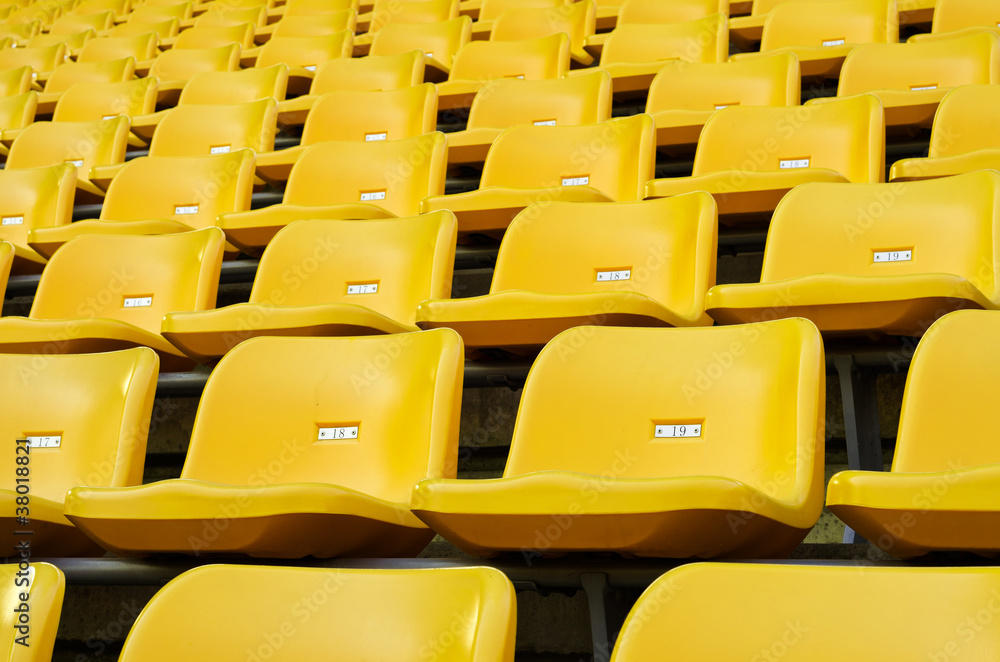 Fototapeta premium Yellow Empty plastic seats at stadium