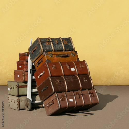 A Pile of Old Vintage Suitcases - Luggage