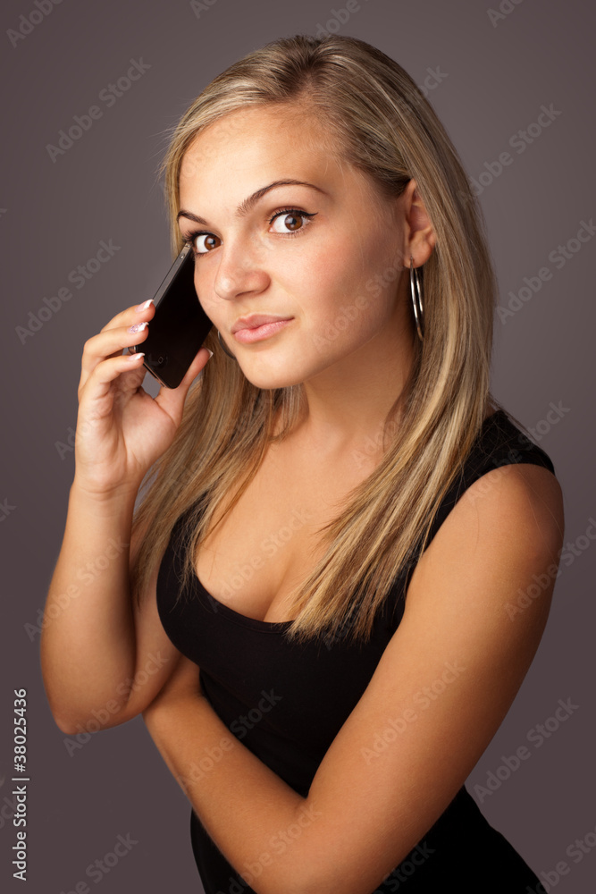 portrait of a cute young woman speaking on the mobile portrait of a cute young woman speaking on the mobile