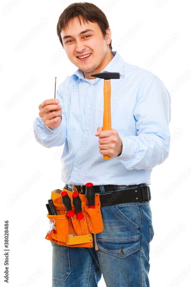 Smiling construction stretching hammer and nail Smiling construction stretching hammer and nail
