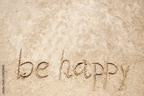 Be happy handwritten in sand for natural, symbol,tourism