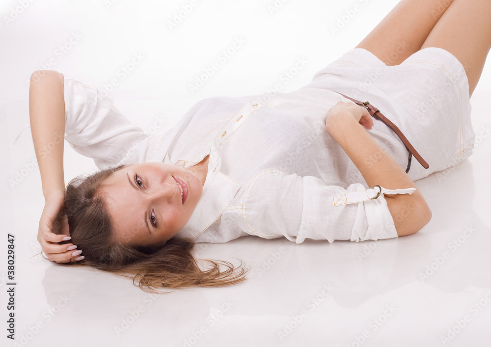 Beautiful girl lying on a floor