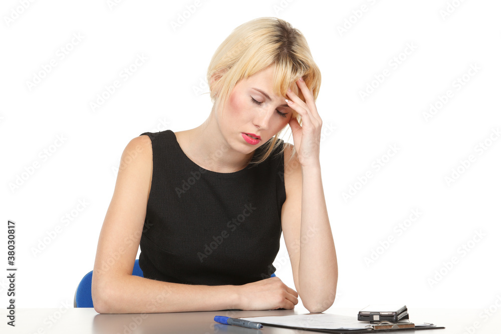 Tired business woman working on her workspace Tired business woman working on her workspace