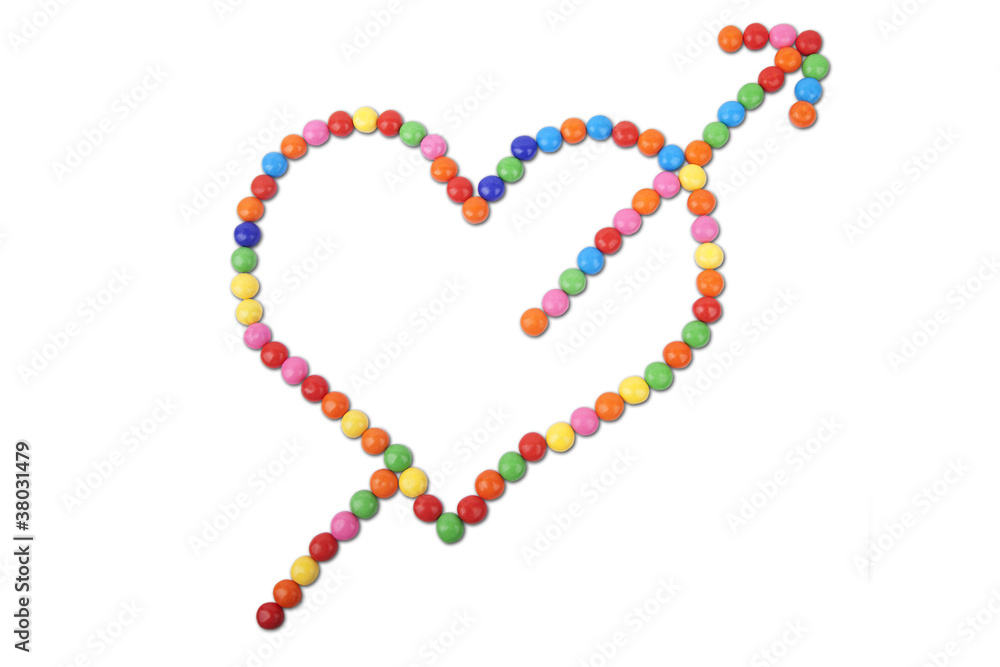 Heart made of colorful candy with arrow