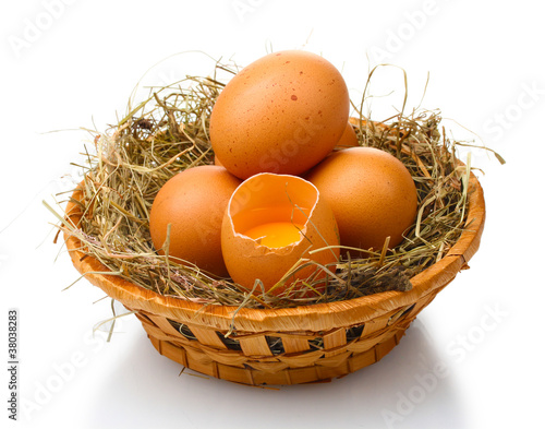 chicken eggs in a nest isolated on white