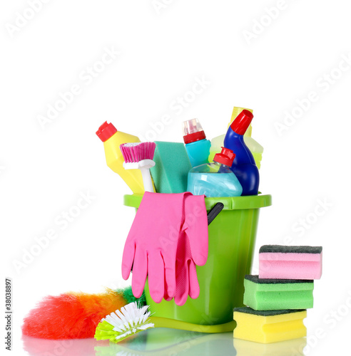 detergent bottles, brushes, gloves and sponges in bucket