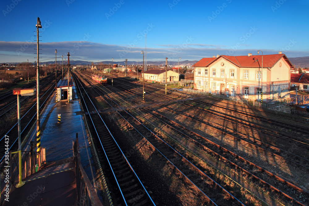 An old train station against a deep blue sky An old train station against a deep blue sky