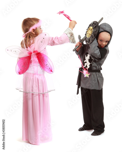 Young girl as magic fairy and boy dressed as a Knight isolated
