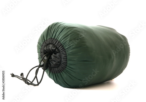 Packed sleeping-bag on white background