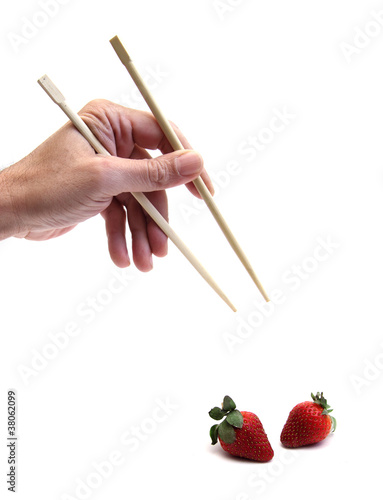 chopsticks and strawberry