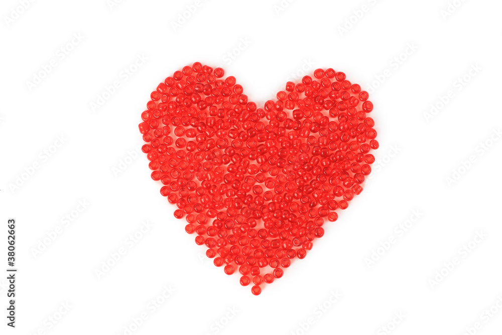Heart made ??of red beads, isolated on red background. Heart made ??of red beads, isolated on red background.