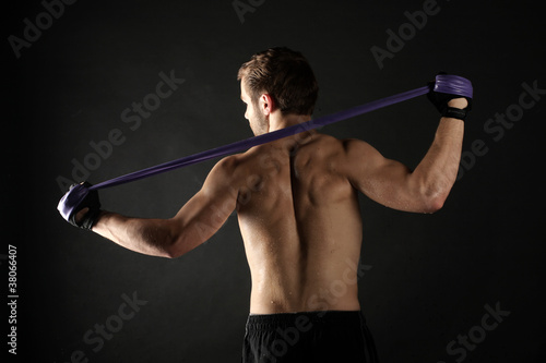 A young athlete training his back muscles