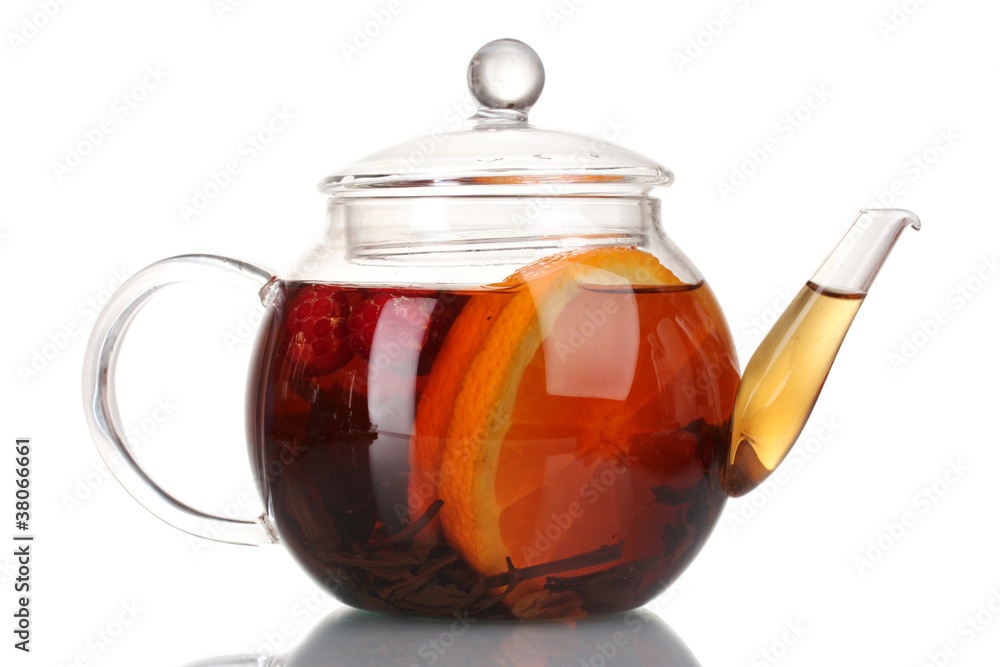 Glass teapot with black tea and orange isolated on white Glass teapot with black tea and orange isolated on white