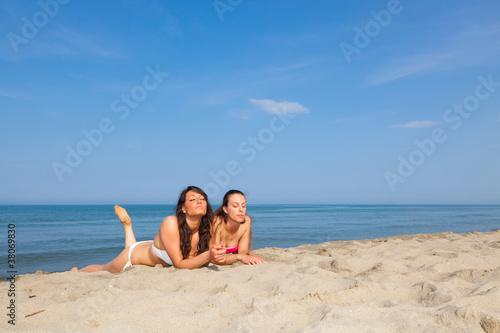 Two Young Women Sunbathing