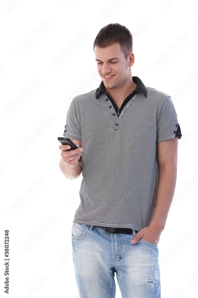 Happy student writing text message Happy student writing text message