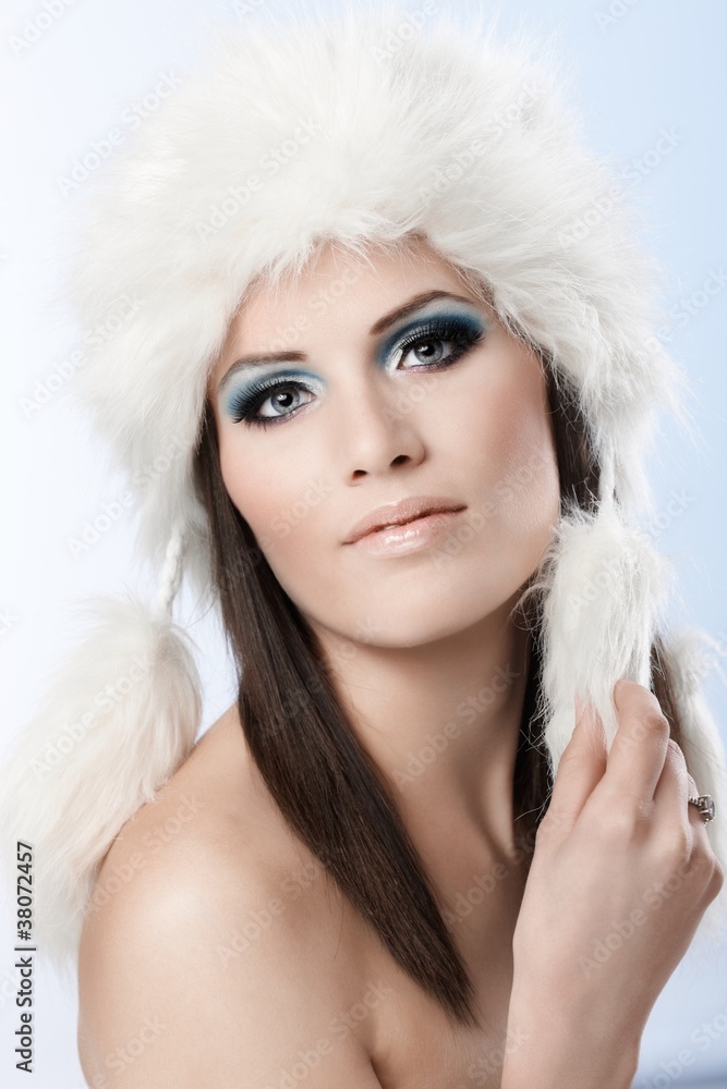 Winter portrait of woman in fur cap Winter portrait of woman in fur cap