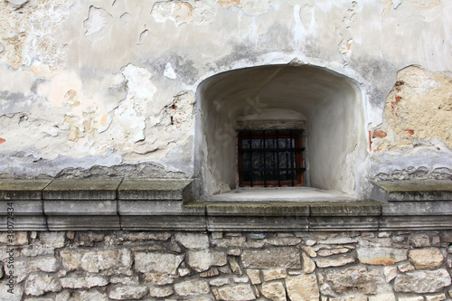 Fototapeta Naklejka Na Ścianę i Meble -  Vintage stone wall with a window