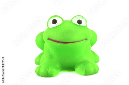 green frog toy on white