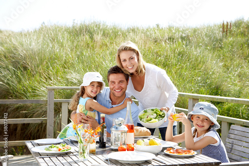 Family on vacation eating outdoors