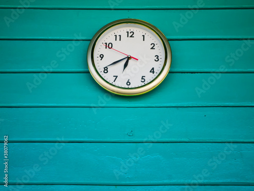 White clock on Green wall