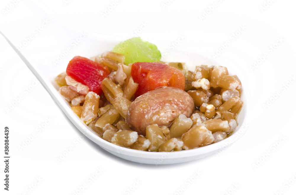 Spelt soup on the white spoon Spelt soup on the white spoon